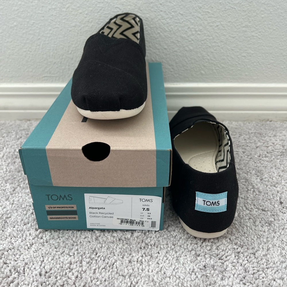 TOMS Woman’s Black Canvas Slip Ons